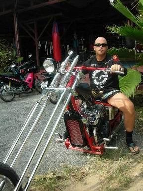 Daniel riding his Thai chopper