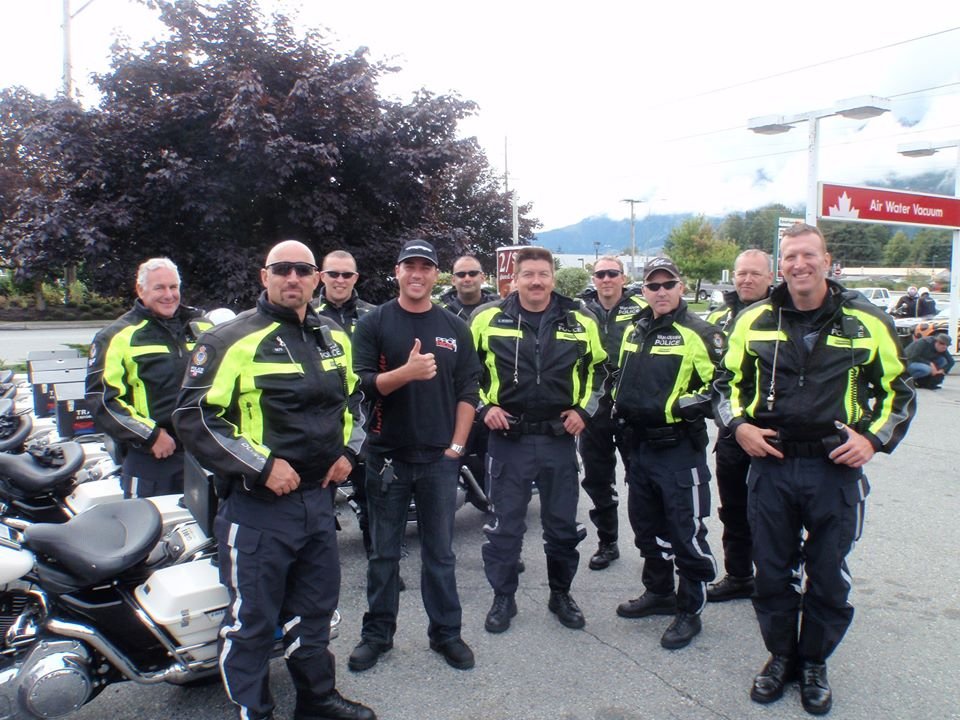 Daniel with police riders after a training session