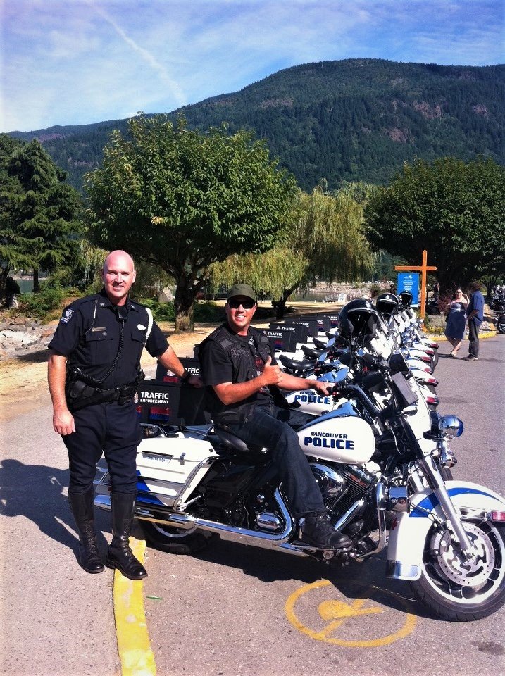Daniel group riding with a police motorcycle squad